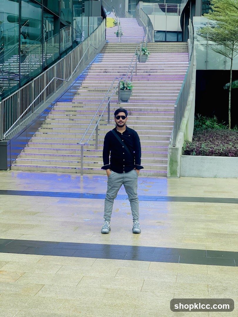 Man Posing on Illuminated Stairs