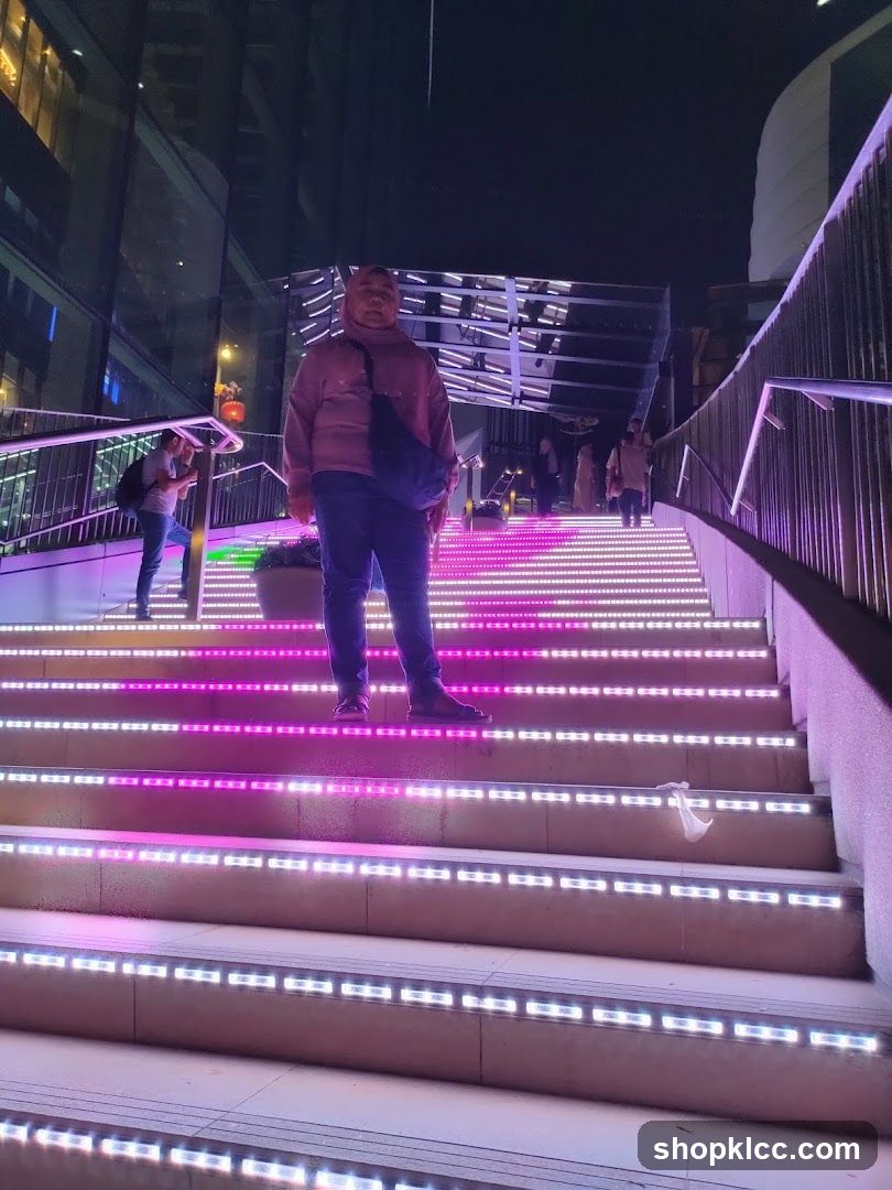 Person on illuminated stairs at night