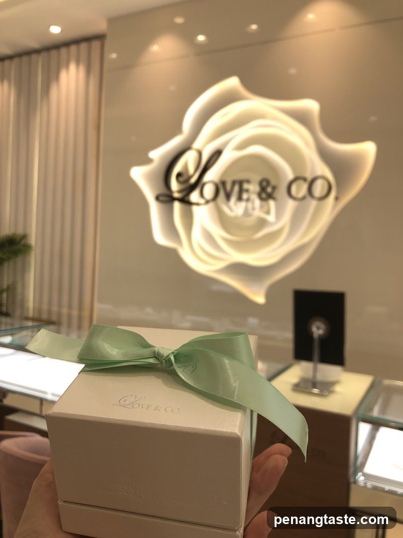 Gift box with ribbon in front of store logo