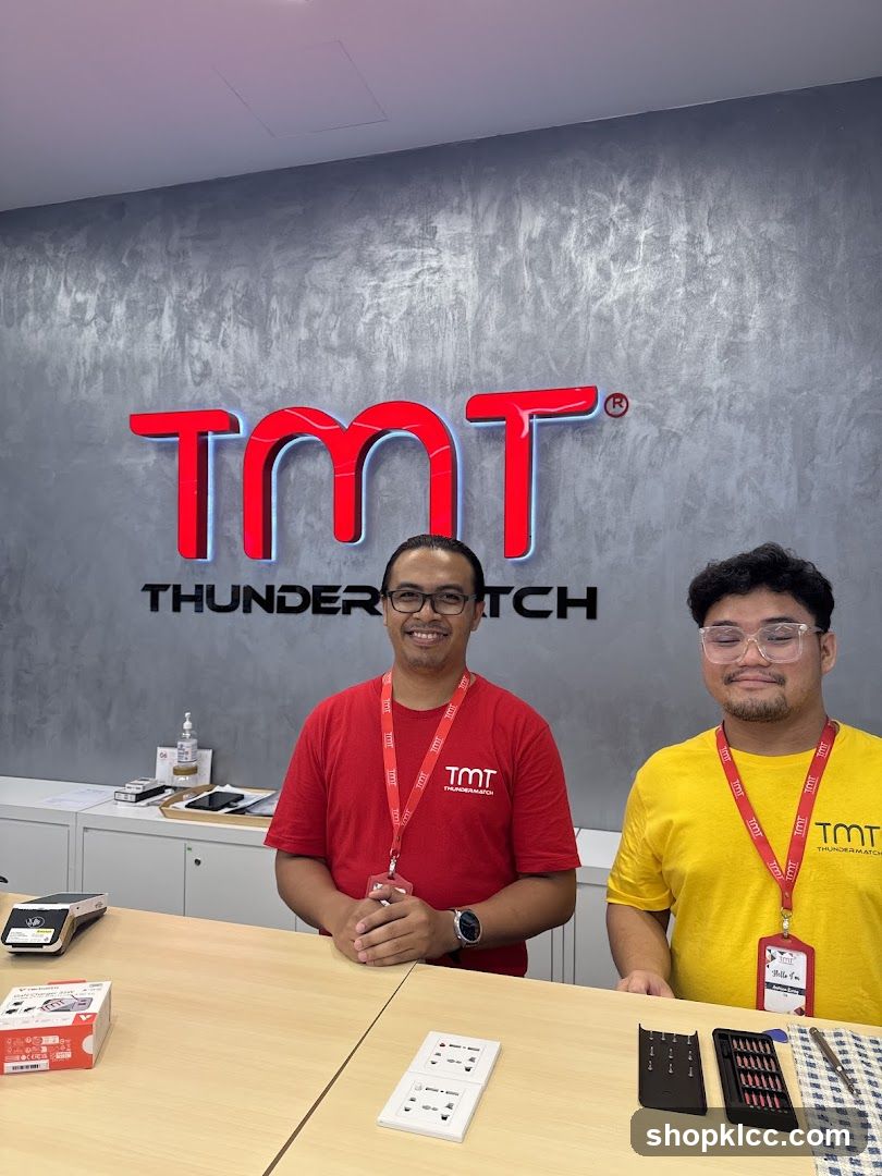 Two Employees Standing Behind a Counter