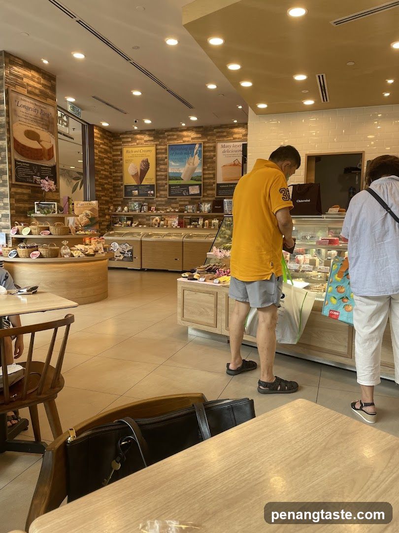 Interior of a bakery with display cases and seating
