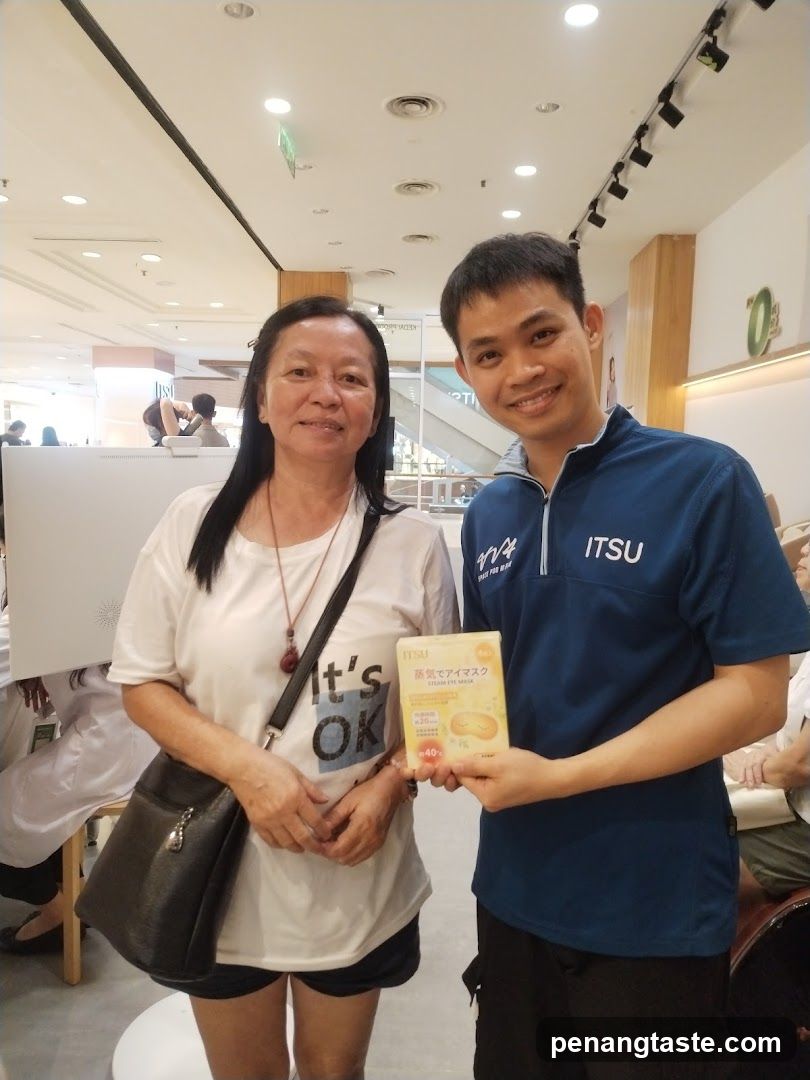 Two people holding a product