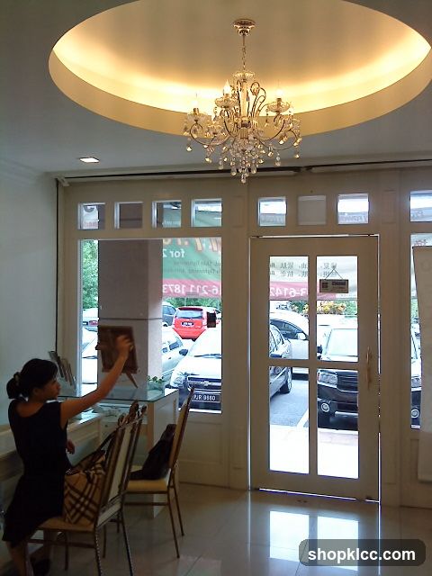 Interior of a shop with staff arranging items