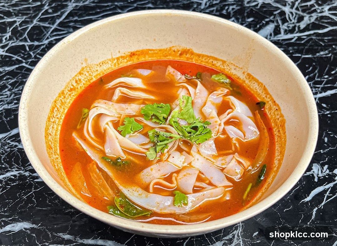 Bowl of Spicy Noodle Soup with Cilantro