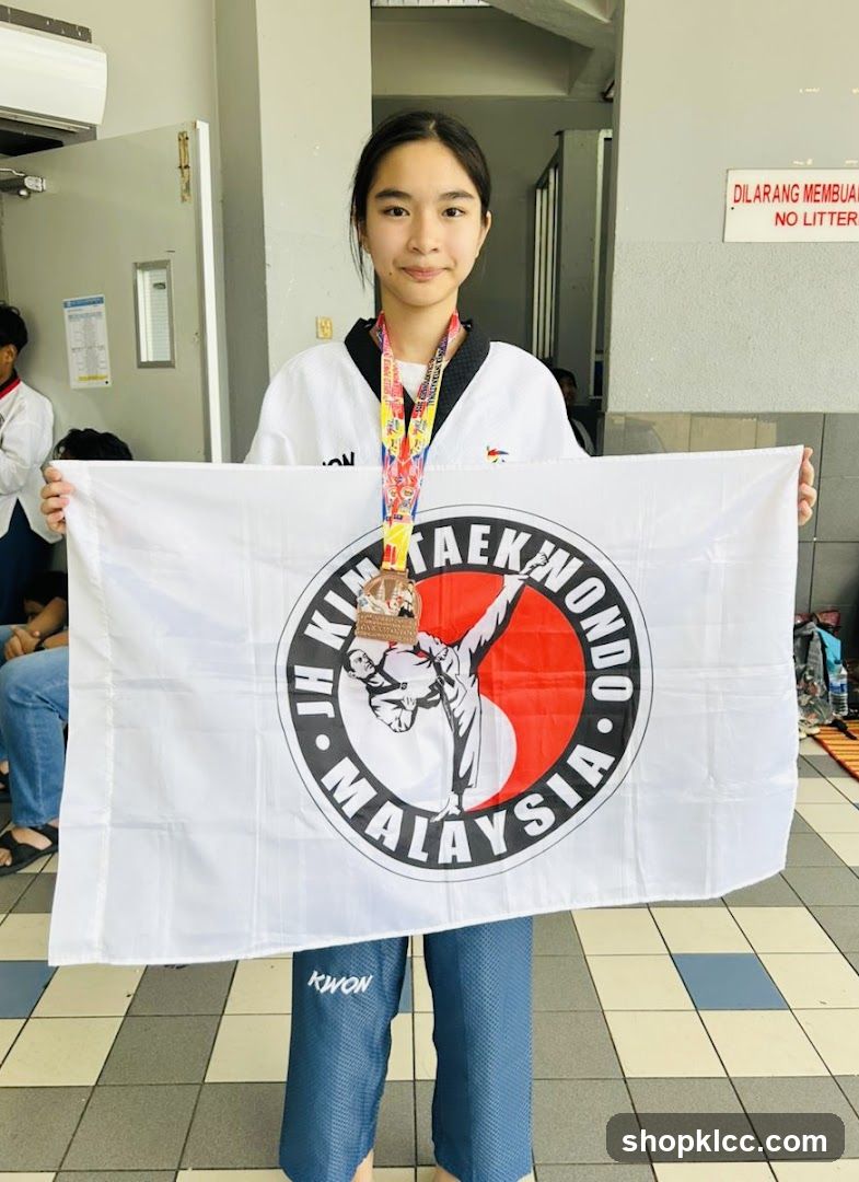 Taekwondo Athlete with Flag and Medal