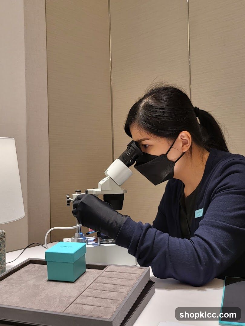 Jeweler examining a ring under a microscope
