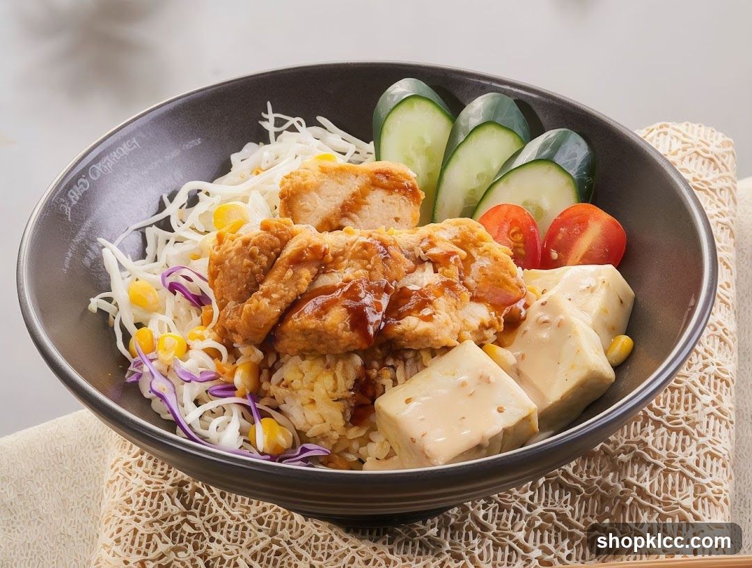 Bowl of Fried Chicken Rice Bowl with Tofu and Vegetables