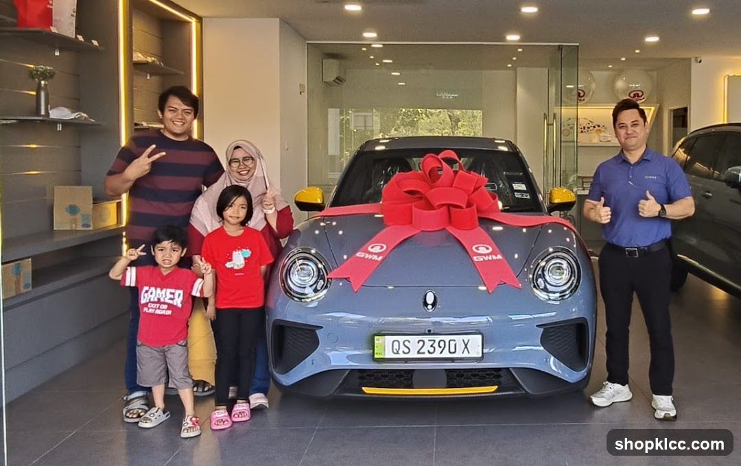 Family posing with a new car