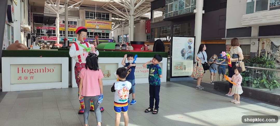 Clown making balloon animals for children
