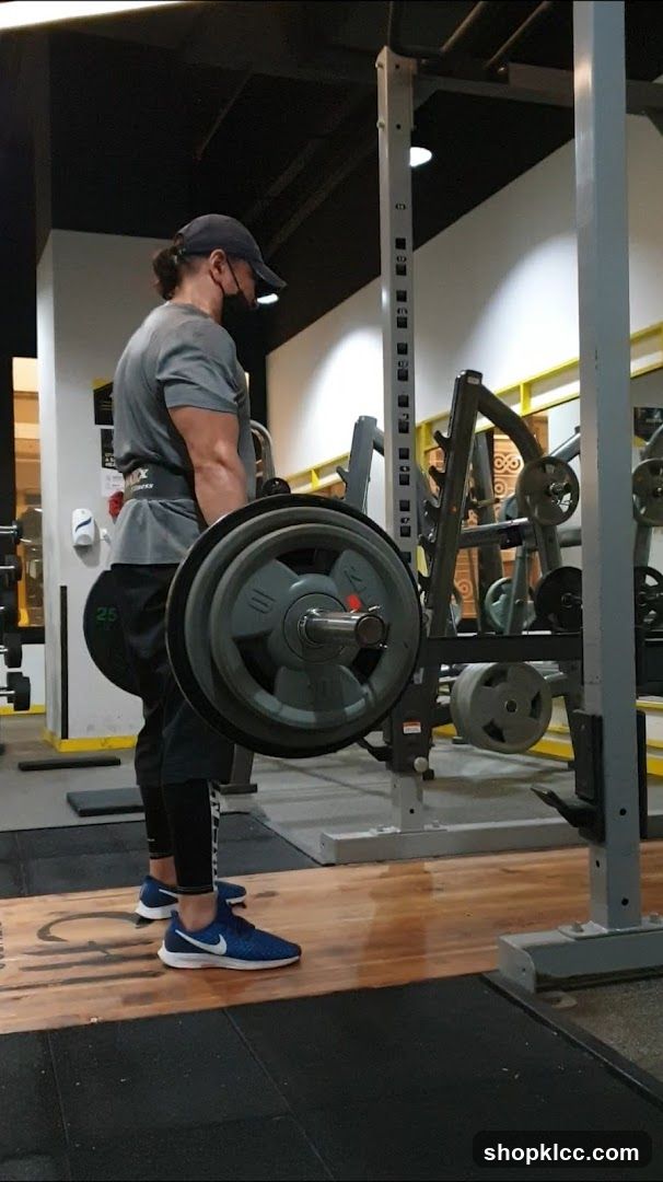 Man performing deadlift in gym