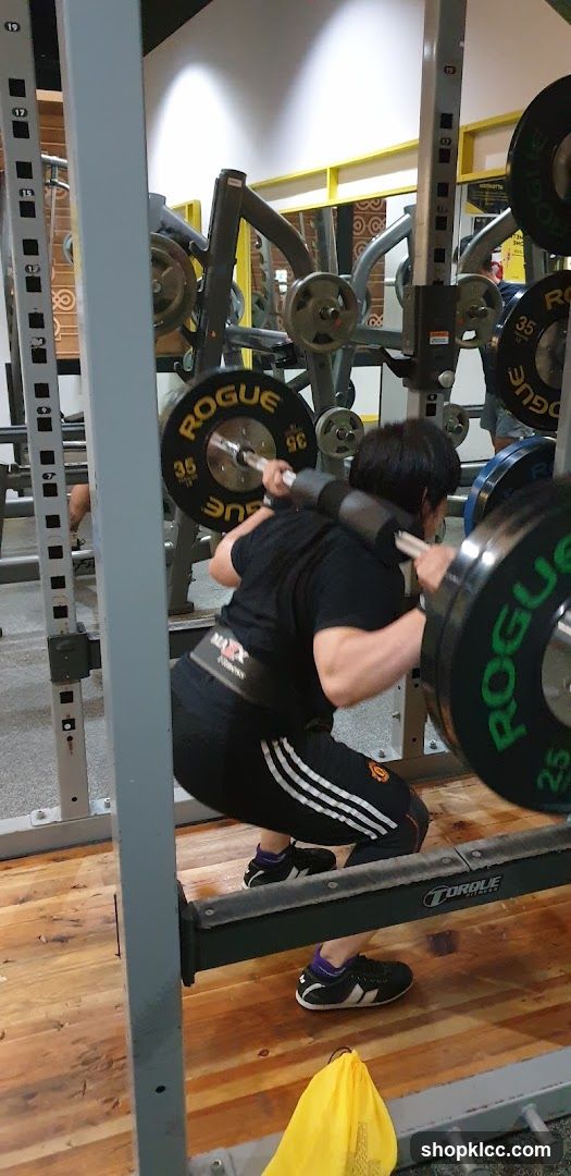 Person performing a barbell squat