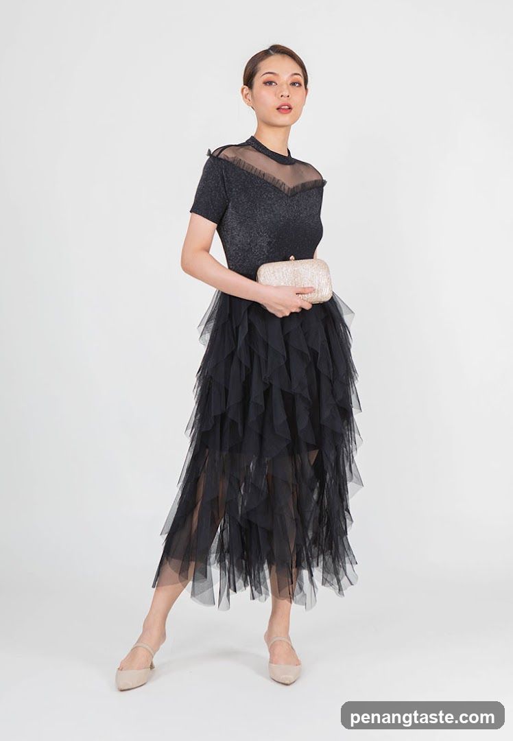 Woman in Black Tulle Dress and Clutch