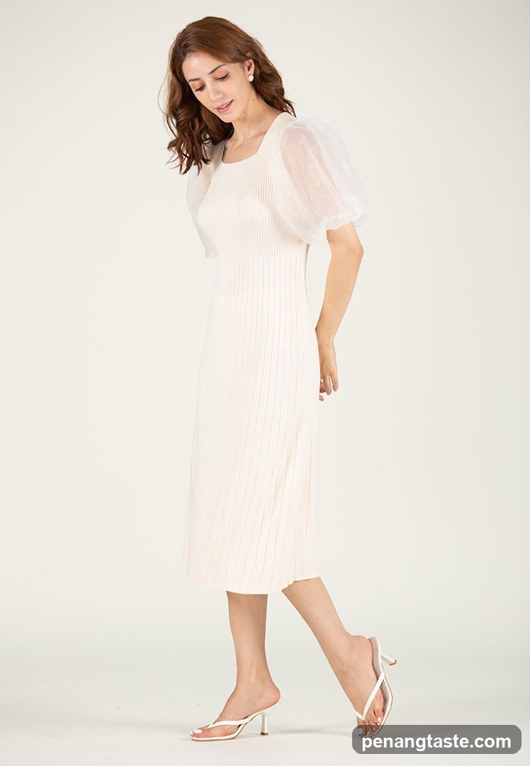 Woman in a cream-colored dress