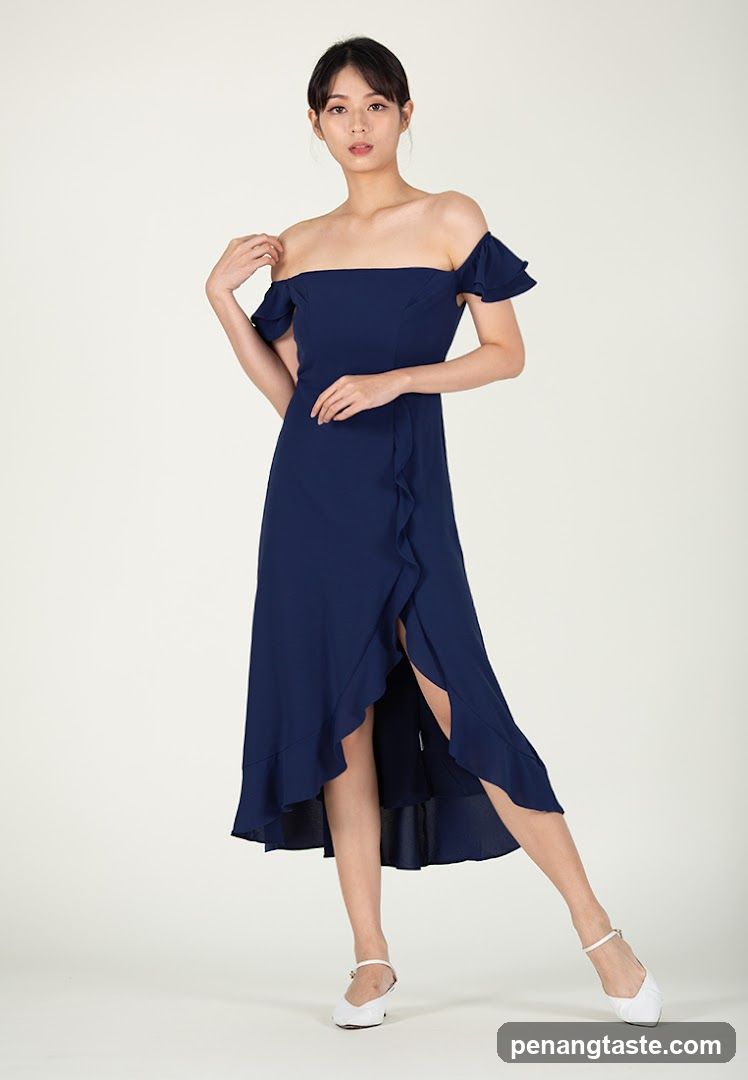 Woman in a navy blue off-the-shoulder dress