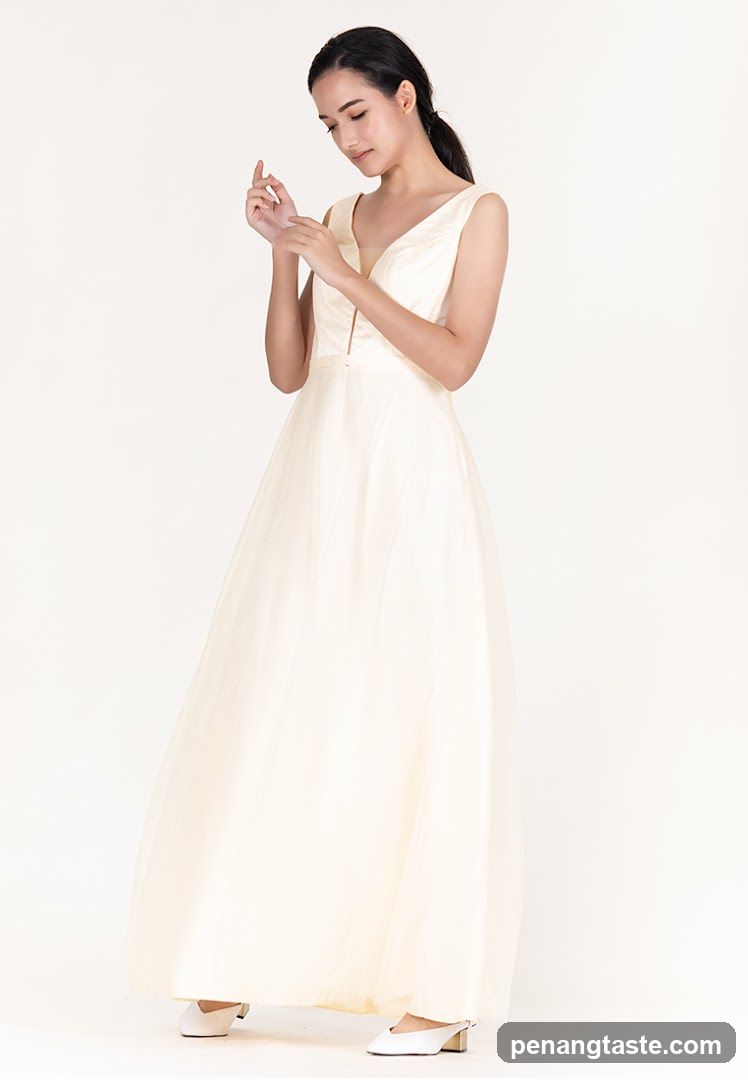 Woman in a cream-colored gown
