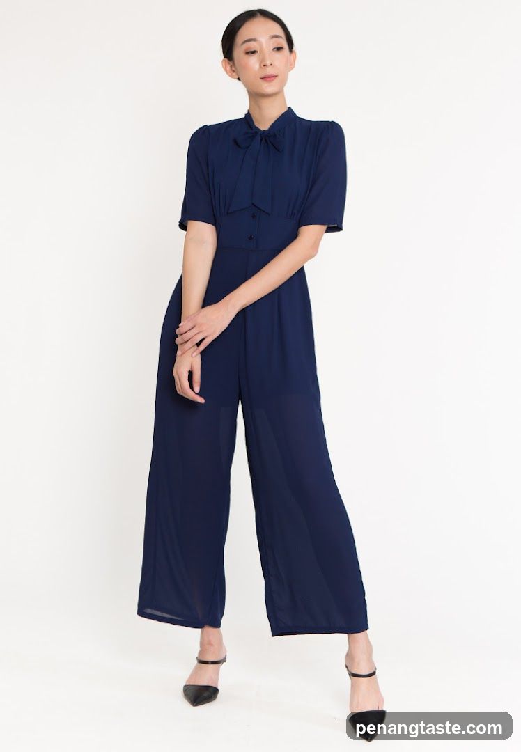 Woman in Navy Jumpsuit