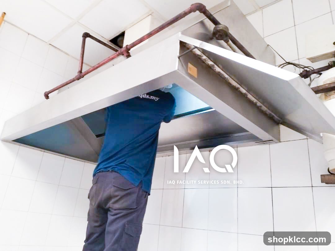 IAQ Facility Services Worker Cleaning Hood