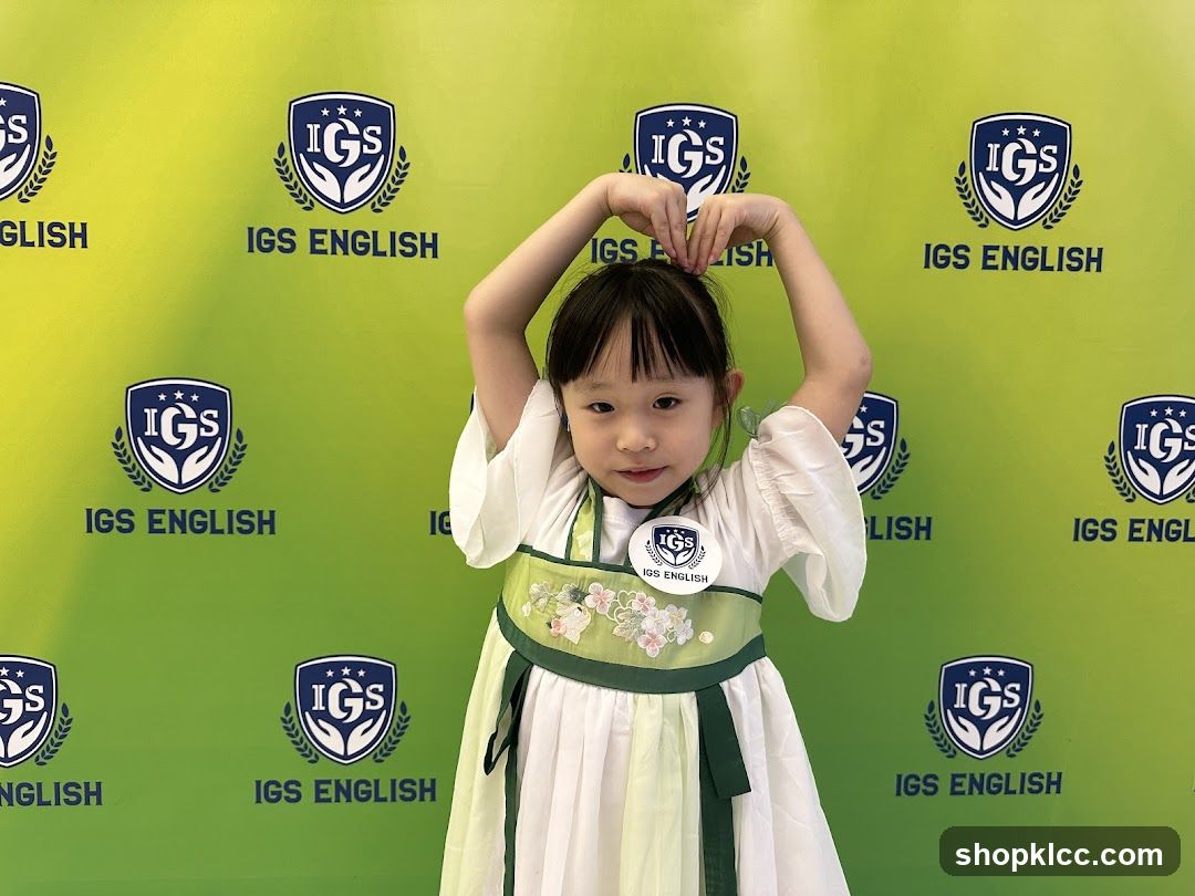 Young girl in traditional dress making a heart shape with her hands