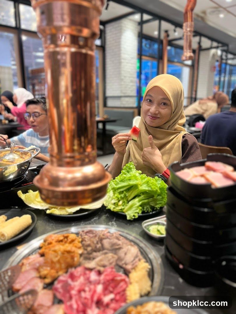 People enjoying a meal at a Korean BBQ restaurant