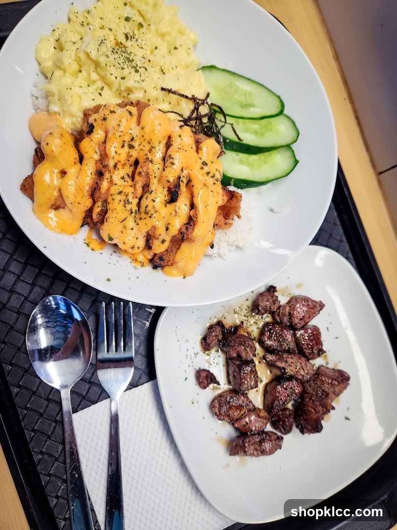 Two plates of food with cutlery