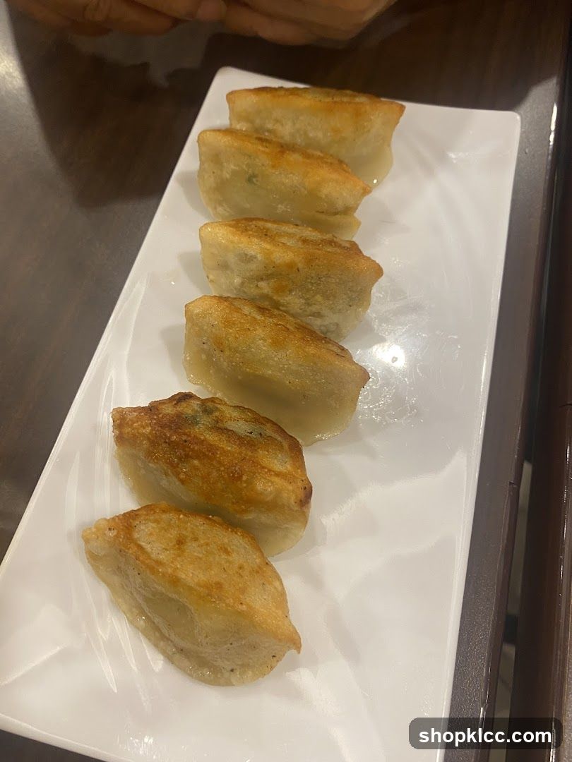 Gyoza on a white rectangular plate
