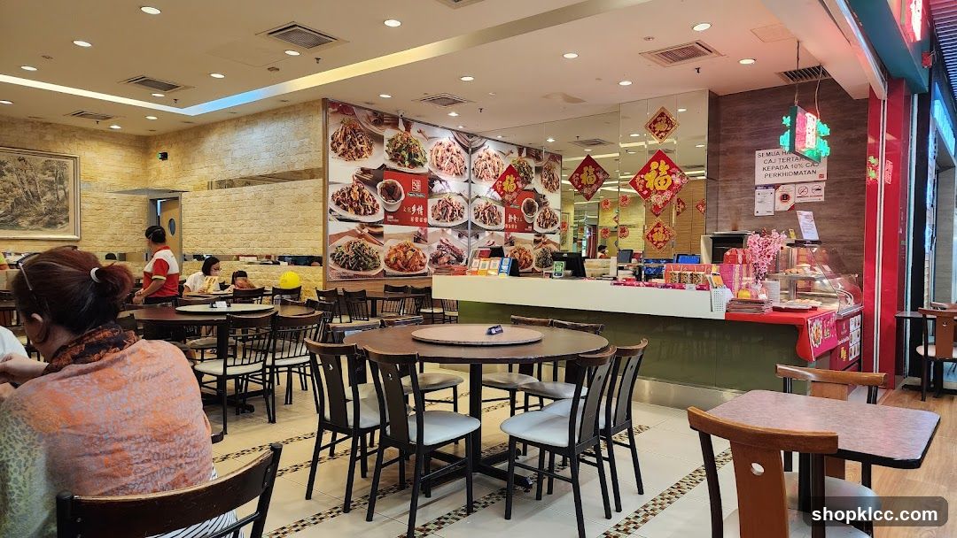 Restaurant Interior with Menu Board and Staff