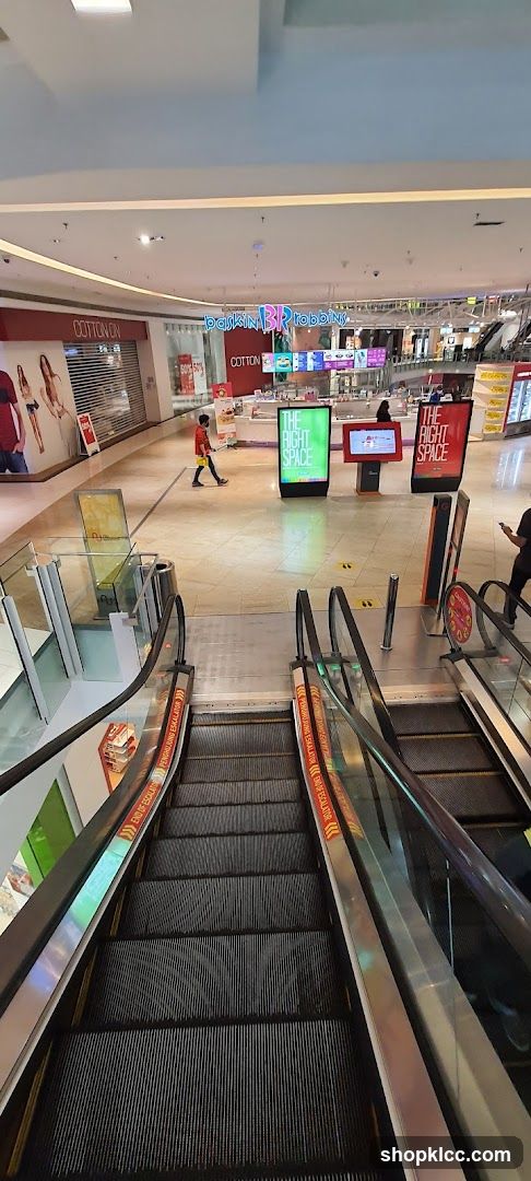 Mall Interior with Escalators and Shops