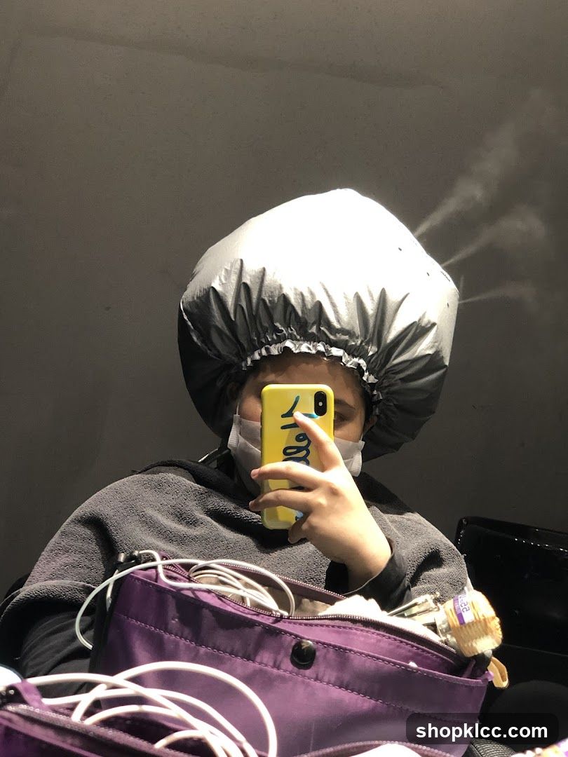 Woman with hair steamer