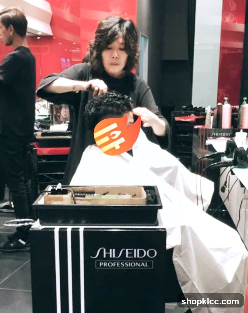 Hairdresser cutting hair