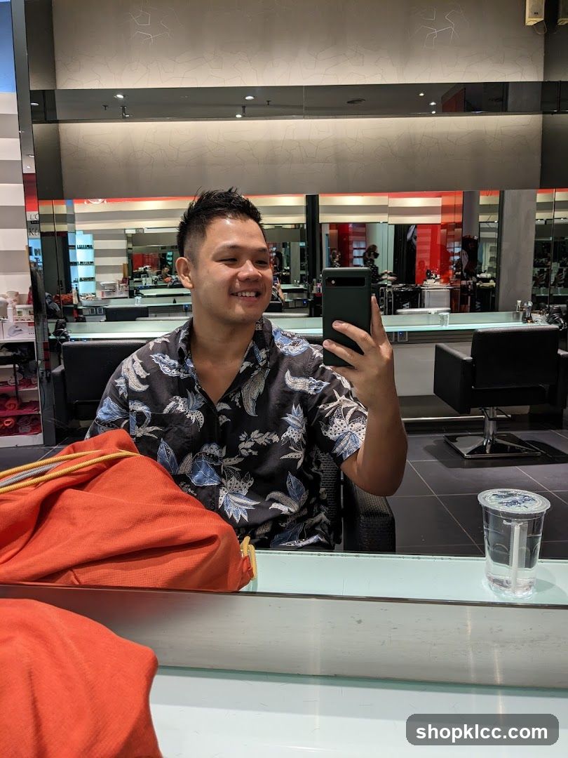 Man taking a selfie in a salon