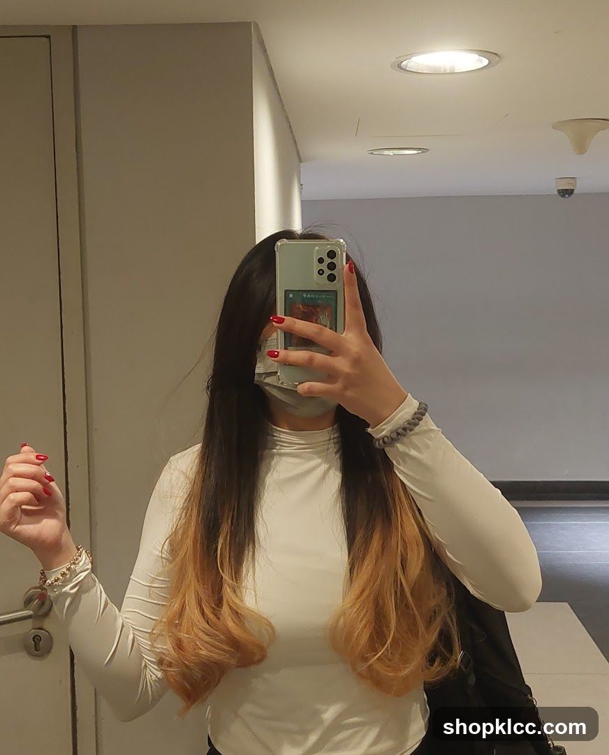 Woman taking a mirror selfie