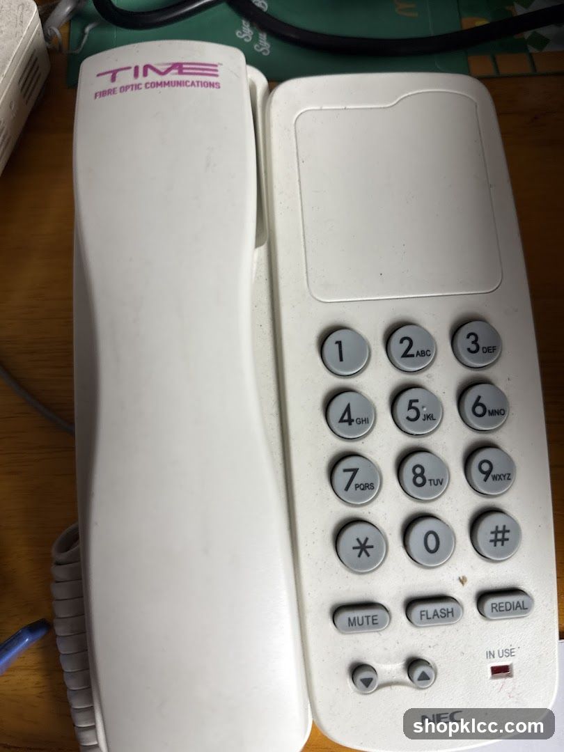 NEC Telephone on Wooden Surface