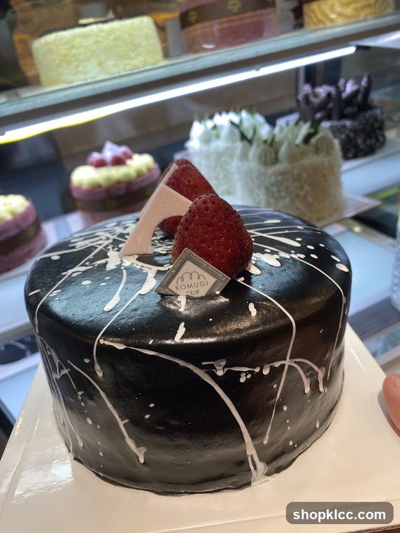 Black Frosted Cake with Strawberries