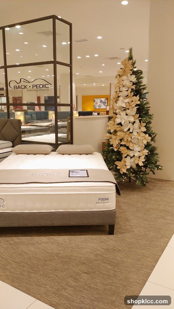 Mattress store display with Christmas tree