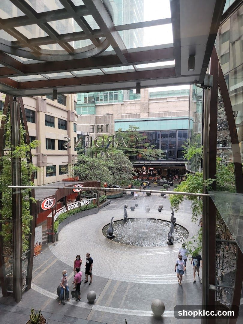 Outdoor Plaza with Fountain and Shops