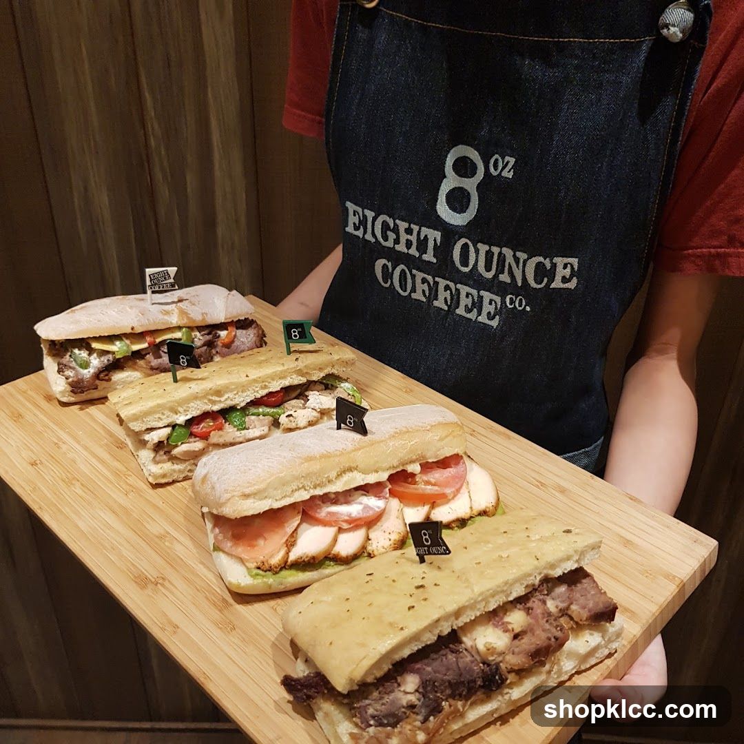 Four Sandwiches on a Wooden Board