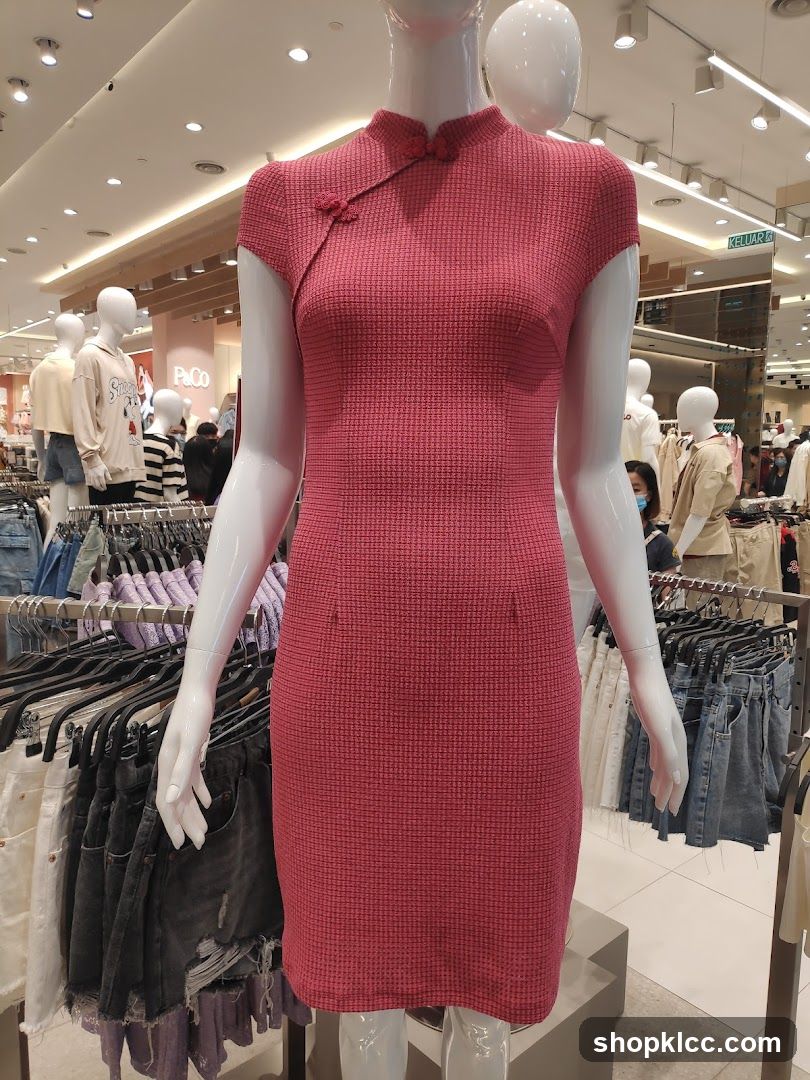 Mannequin wearing a pink dress