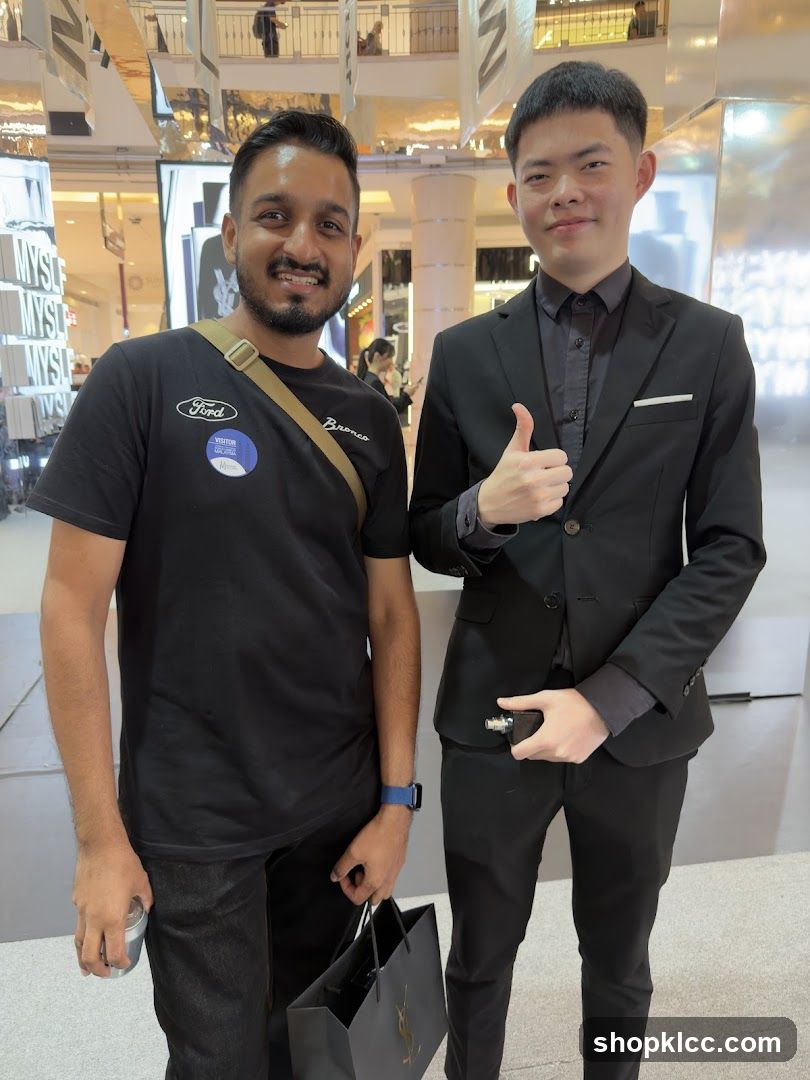 Two men posing for a photo in a mall