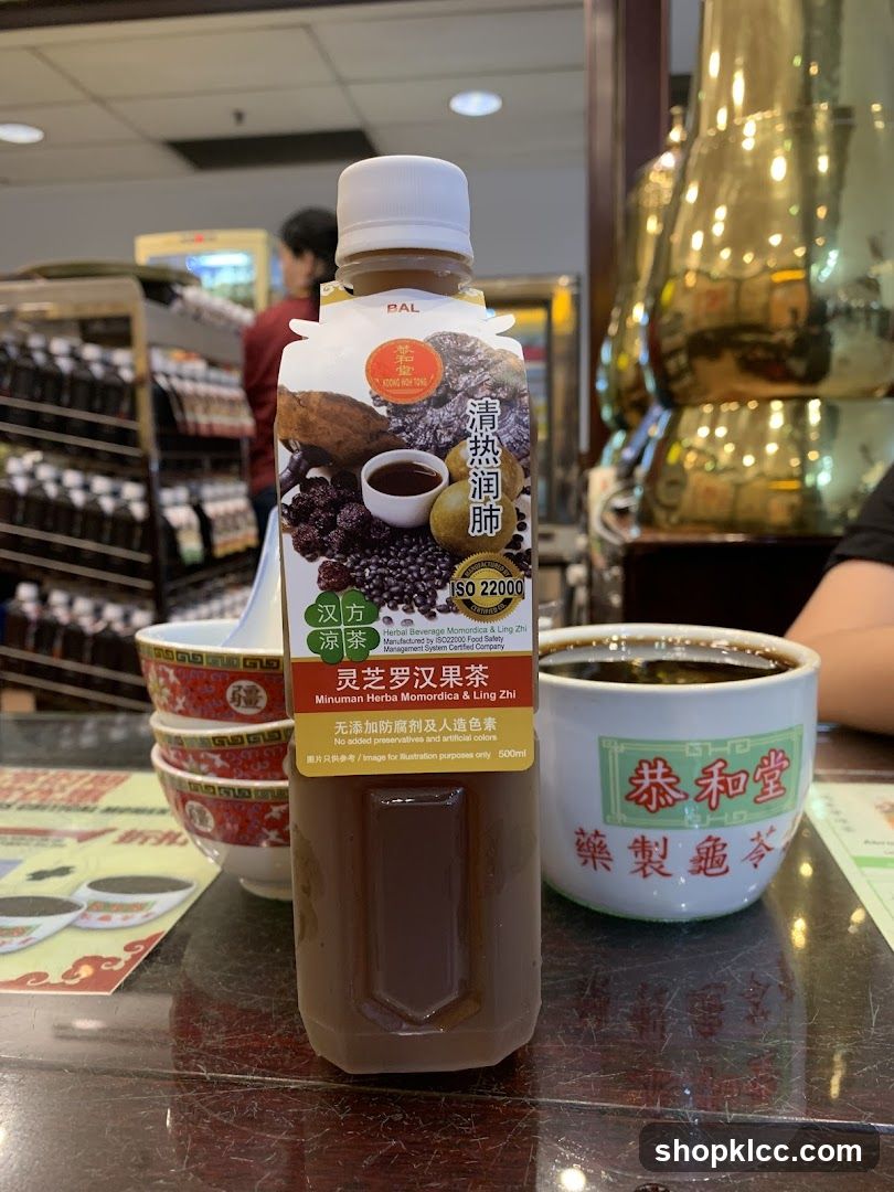 Bottled Tea and Cup on Table