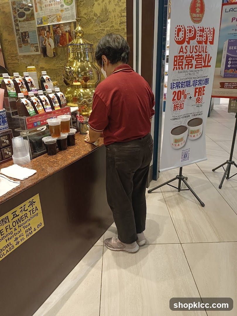 Customer at Tea Shop Counter