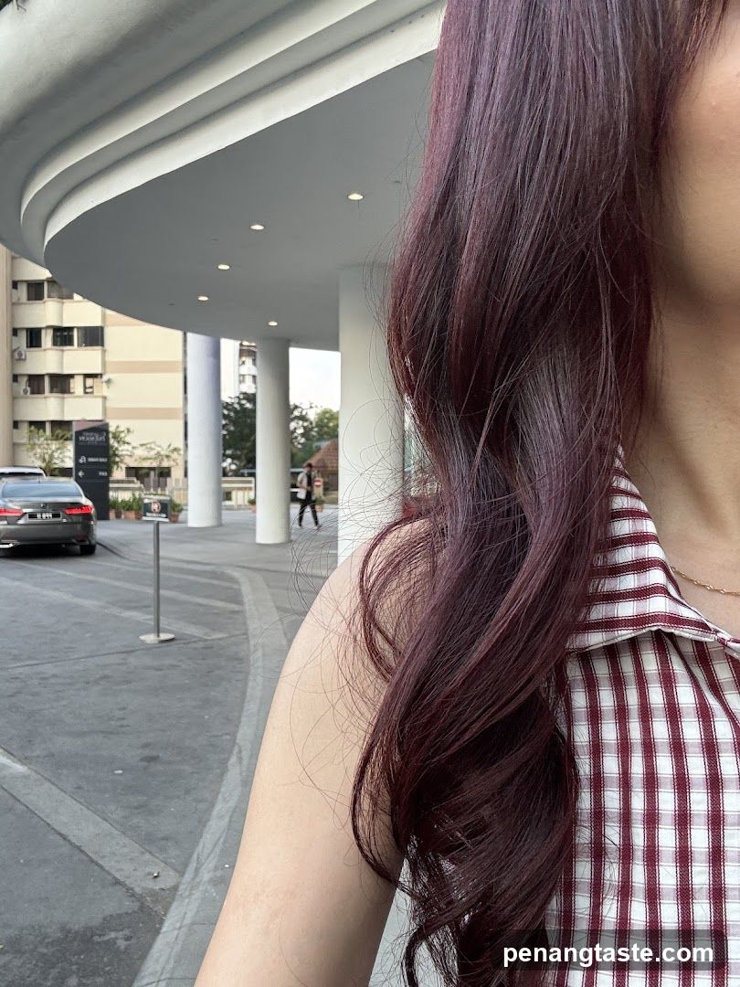 Woman in Gingham Shirt Outside Building