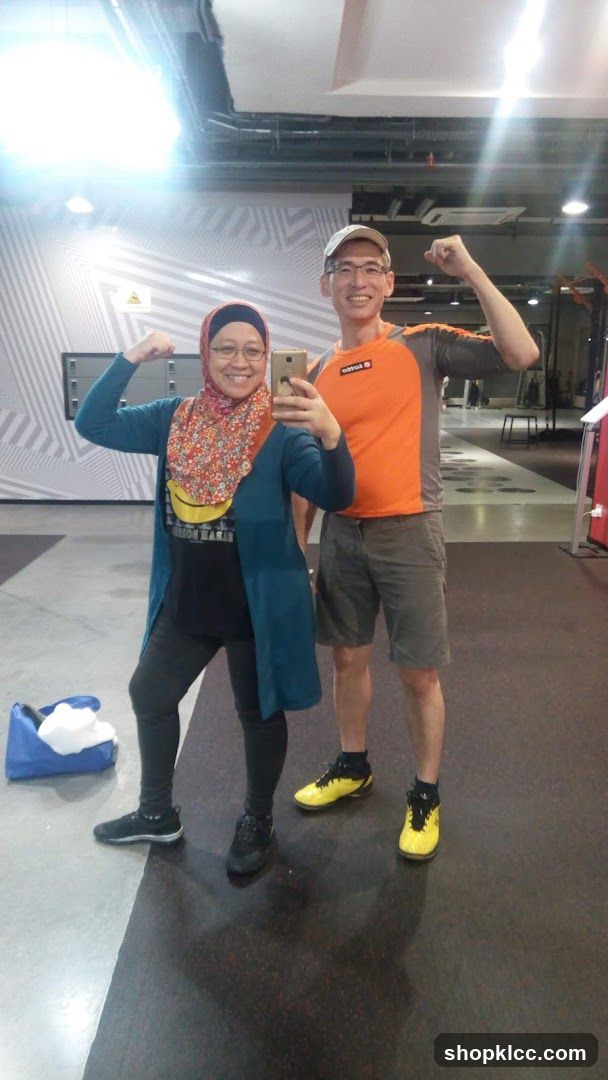 Couple posing in a gym
