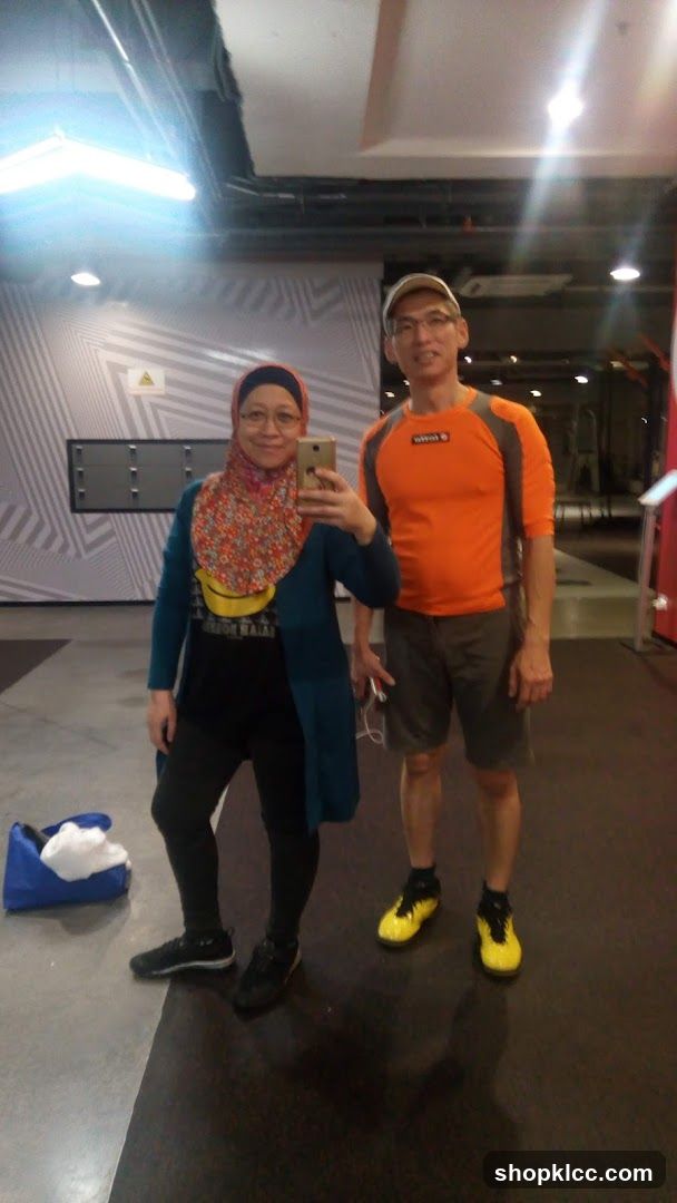 Two people in a gym