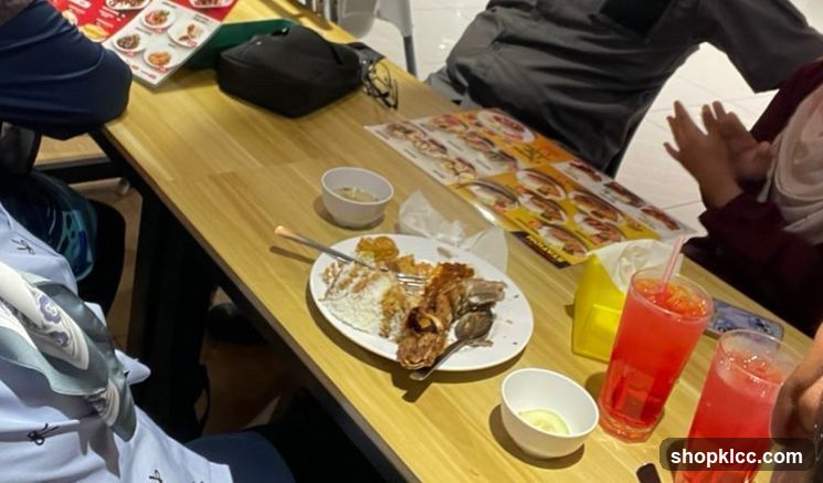 Diners at a table with food and drinks