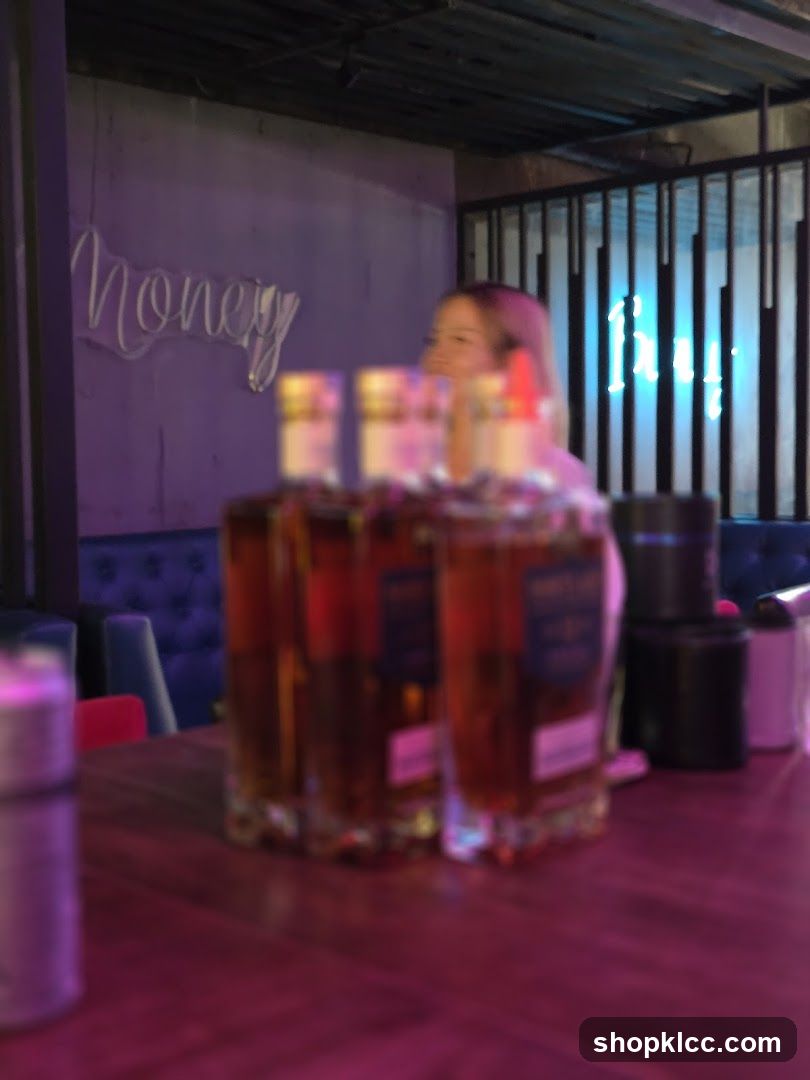 Bar Interior with Bottles and Neon Signs