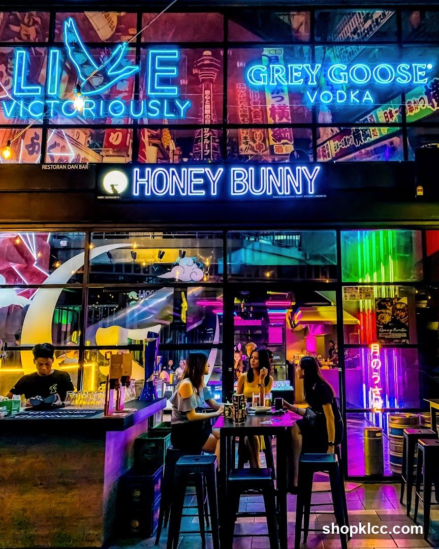 Neon-lit bar interior with patrons