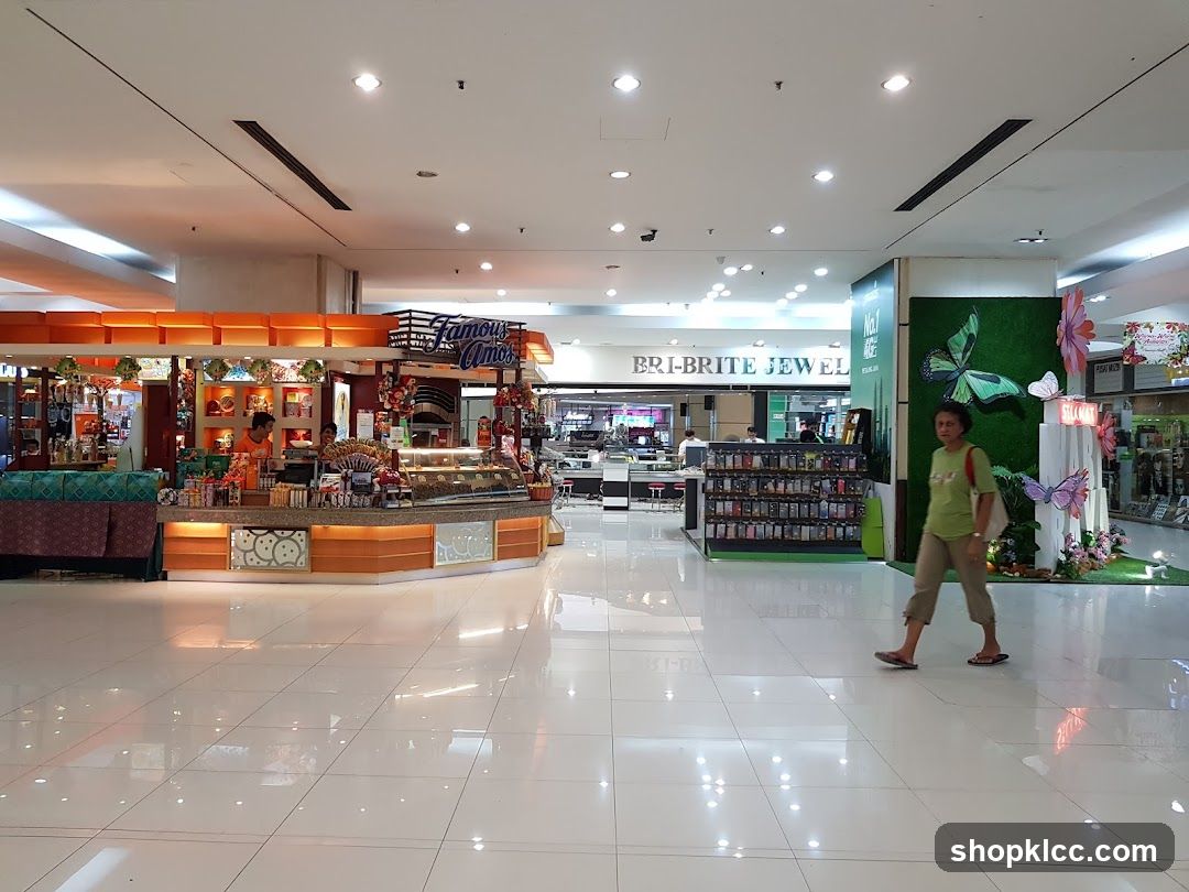 Mall interior with food kiosk and jewelry store