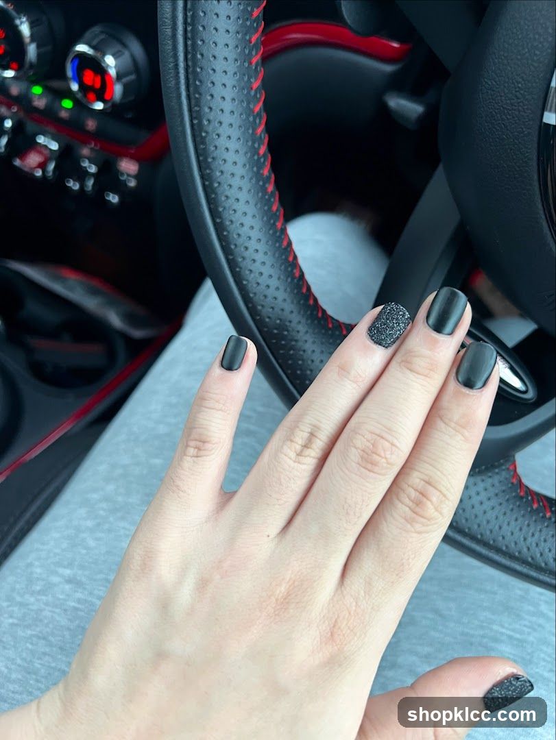 Matte Black Nails with Glitter Accent