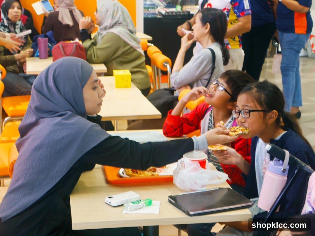 People eating pizza at a food court