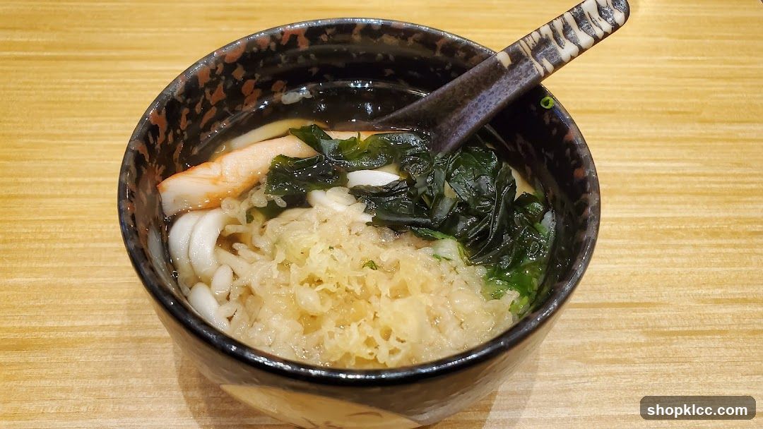 Bowl of Japanese-style noodle soup with seafood and seaweed